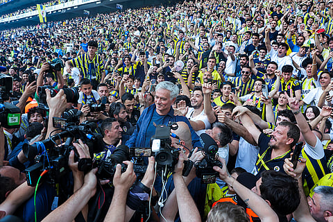 Fenerbahce new coach Jose Mourinho poses with supporters
